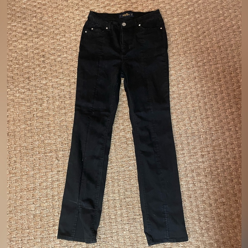 black flare boot jeans with a front slit